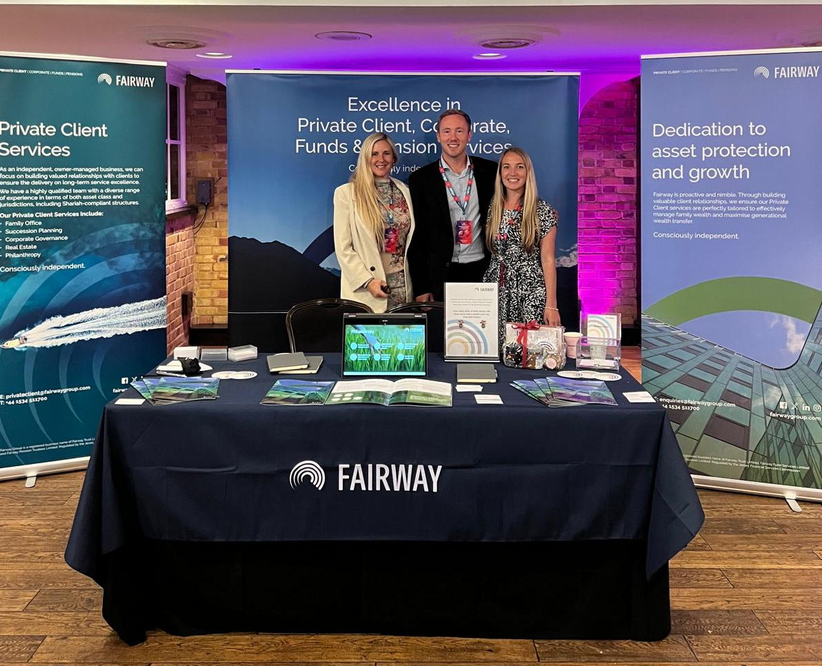 Jodie Gray, Director in Private Client, Chris Mourant, Associate Director in Private Client and Aleisha Stilwell, Head of Marketing and Business Development at Fairway's exhibition stand.