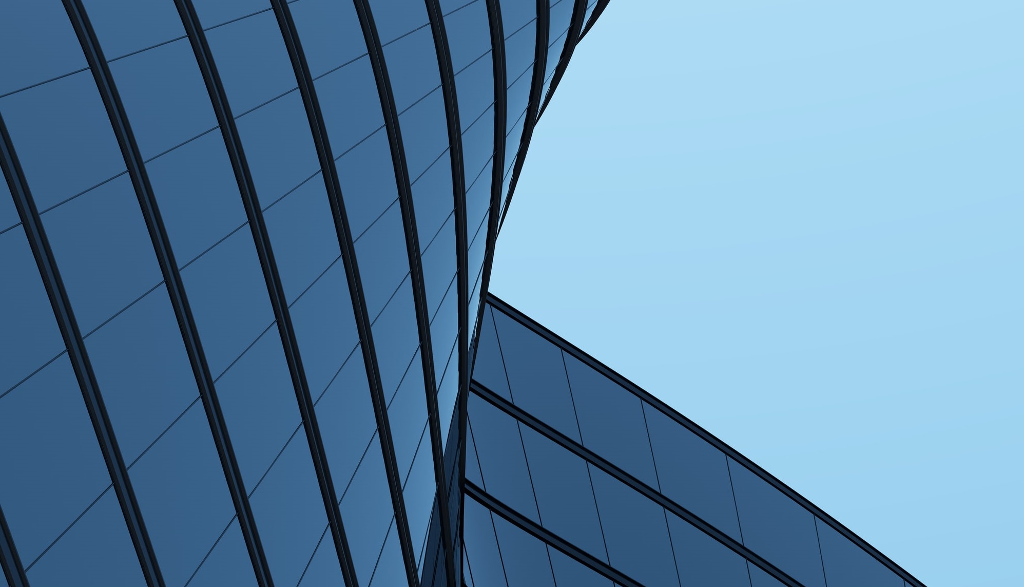 Istock 3D Stimulate Of High Rise Curve Glass Building And Dark Steel Window System On Blue Clear Sky Background Compressed Copy